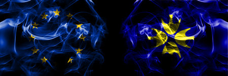 Flags of EU, European Union vs Japan, Japanese, Niikappu, Hokkaido, Hidaka, Subprefecture. Smoke flag placed side by side on black background.の写真素材