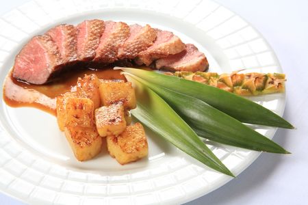 Pork loin with roasted pineappleの写真素材