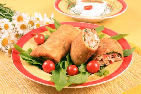 Breaded pieces of fish in pancakes の写真素材
