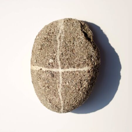 The stone with the sign plus isolated on whiteの写真素材