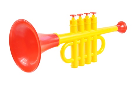 Children trumpet made of colored plastic against white backgroundの写真素材