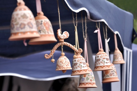 Clay souvenir bells decorated with paintings of Russian folkの写真素材