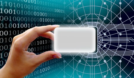 Collage electronic plastic card in hand on the background of the computer code and reader. The concept of securityの写真素材