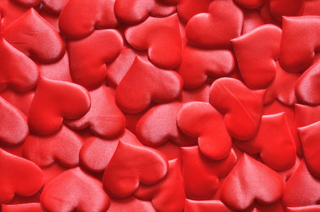 A scattering of red souvenir hearts as an abstract background