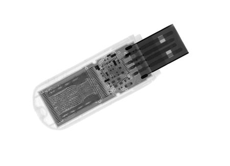 USB flash drive under the X-rays in black tones