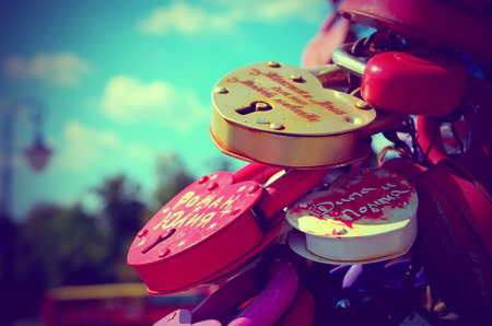 Colored wedding locks against the blue sky with clouds. のeditorial素材