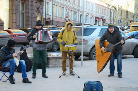 MOSCOW, RUSSIA - FEBRUARY 19, 2015: An unidentified street musical ensemble plays musical instruments on a pedestrian street  Kuznetsky Bridge in Moscow on February 18, 2015.のeditorial素材