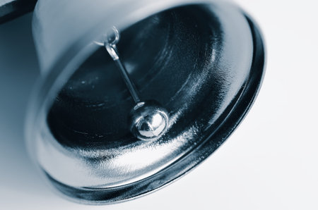 Detail of small steel bell. Close up view, macro, selective focus. New Year, Christmas. Vintage...