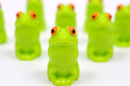 Platoon green toy frogs.