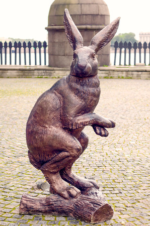 The bronze statue of hare on the street. Old retro tinting.のeditorial素材