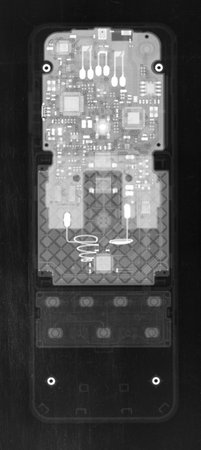 TV remote control under X-rays in negative. Visibility through. Image was obtained with real X-ray machine.の写真素材