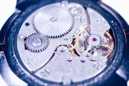 Gears old mechanical watches. Pendulum, cogs under the hood. Close up view, selective focus.Vintage...