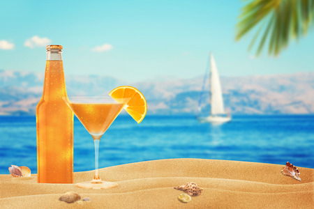 vacation with a cocktail on the beachの写真素材