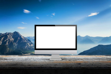 computer display on desk with mountain in the background mock up presentation