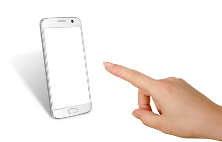 Woman hand touching display of white isolated smart phone. White screen for mockup.の写真素材