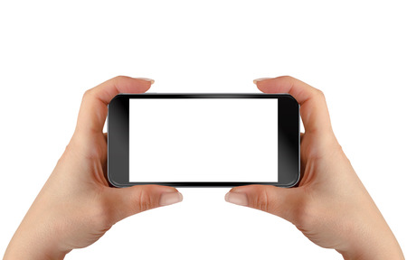 Smart phone in woman hands. Horizontal position. Isolated screen for mockup.の写真素材