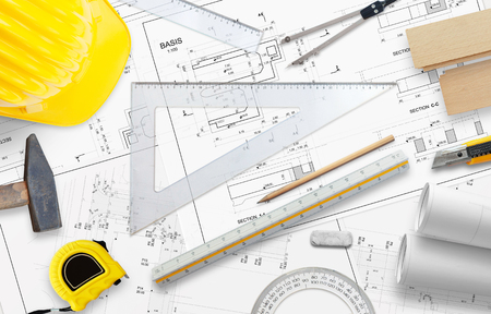 Planning business building. On the table are a ruler, pencil and other construction accessories.の写真素材