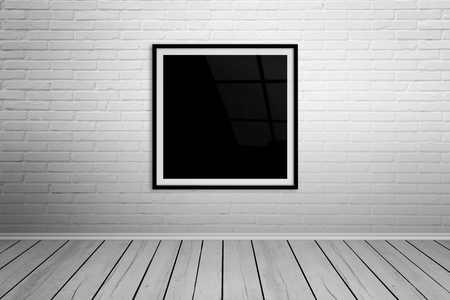 Square frame on brick wall mockup.の写真素材