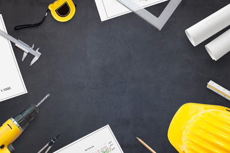 Construction industry concept. Projects and tools on work desk with free space for text. Hero header image concept. Flat lay, Top view.の写真素材