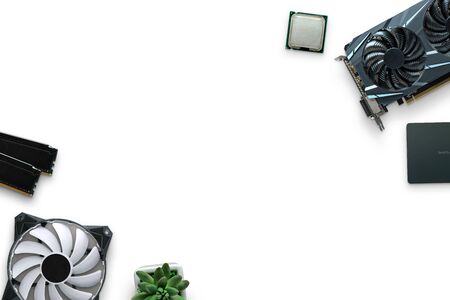 Computer components on a white desk. Graphic card, SSD, processor, RAM, cooler. Top view composition. Copy space in the middle.の写真素材