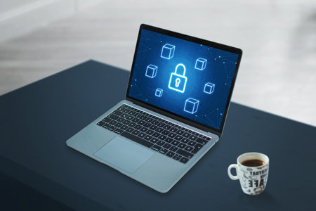 Laptop with blockchain security concept icons. Clean scene of work desk with cup of coffee.