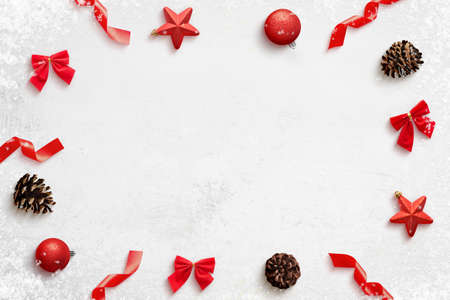 Christmas composition with red decorations on clean surface wirh copy space in the middle. Top view, flat layの写真素材