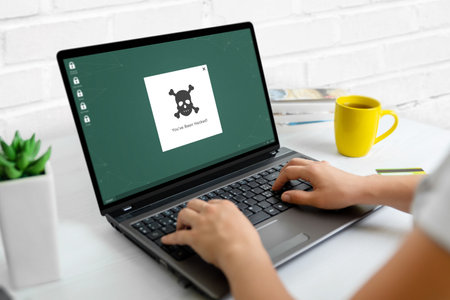 Hacked warning on laptop computer concept. Concept of data protection and securityの写真素材