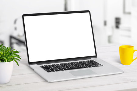 Laptop mockup close-up on white desk. Work from home conceptの写真素材