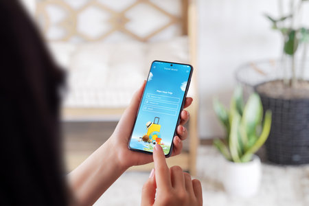 Girl use smart phone for plan a trip. Modern phone app with search tour option. Phone in girl hands....