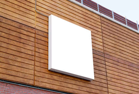 White square billboard on building wall for mockup, poster design presentationの写真素材