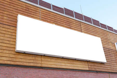 Large wide billboard mockup on building wall for marketing campaign promotionの写真素材