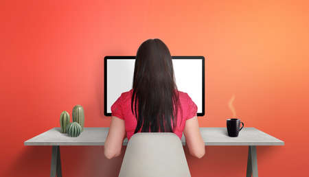 Girl work on computer. Remote, work from home concept. Work desk with plants and coffee mugの写真素材