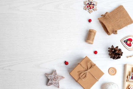 Rustic Christmas decorations on white wooden background. Top view, flat lay composition with copy spaceの写真素材