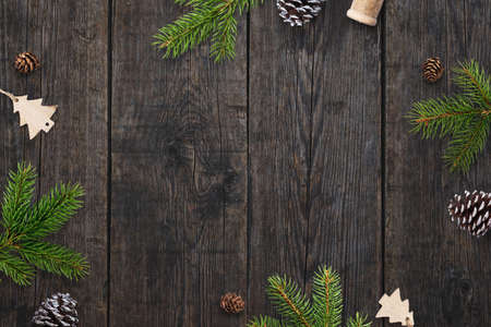 Christmas greeting card background with Christmas decorations on dark wooden table. Top view, flat lay compositionの写真素材