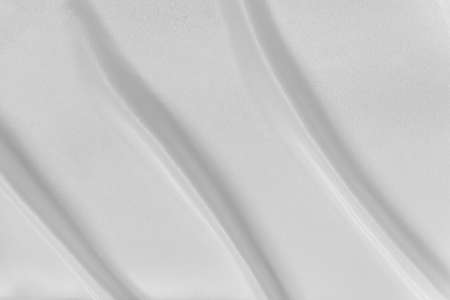 White flag texture with waves. Satin fabricの写真素材