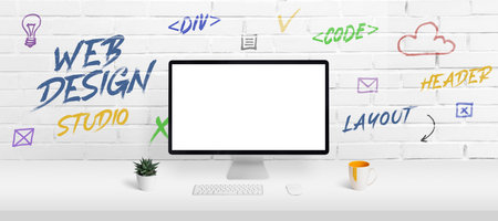 Web design studio concept with computer display mockup and work desk. Creative web page icons and inscriptions on the brick wallの写真素材