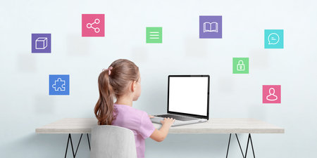 Little girl work on a laptop computer. Internet of things concept. Isolated laptop display for...