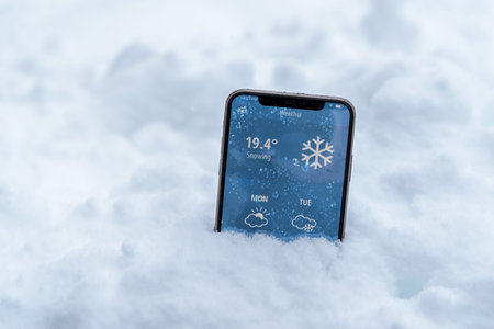 Phone  on snow.の写真素材