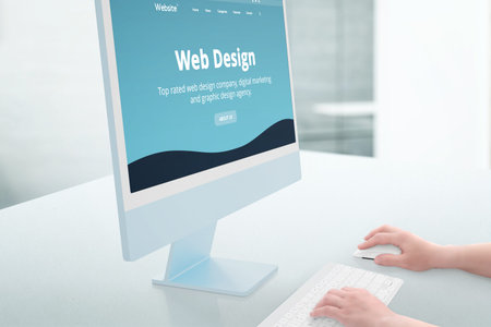 Web design studio showcase on modern computer display. Woman hands use keyboard and mouse. Studio...