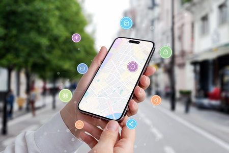 Find a location via a phone concept. Map of city on phone display with icons and network nodes...