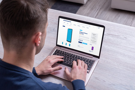 Purchasing smartphone online with laptop. Concept of buying tech devices online, illustrating...