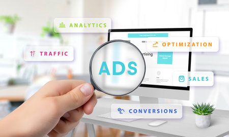 Magnifying glass highlighting Ads on computer screen with floating icons for analytics, traffic, optimization, sales, and conversions, symbolizing digital marketingの写真素材