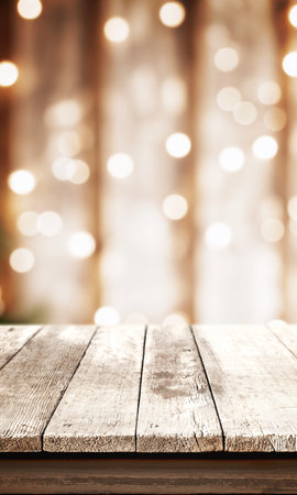 White rustic table with bokeh Christmas lights in the background, front view, providing an empty surface ideal for product promotions and festive campaignsの写真素材