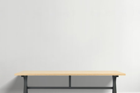 High-end wooden table with elegant grain and industrial black metal legs, modern office furniture concept for sophisticated work environments and creative studiosの写真素材