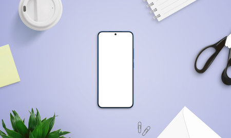 Top view of smartphone mockup on purple desk with creative items like scissors, sticky notes, coffee cup, and notebookの写真素材
