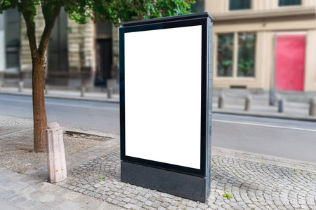 Empty citylight poster on pedestrian street, perfect for commercial campaigns, street marketing or clean outdoor mockup display designsの写真素材