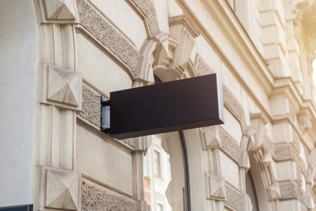 Blank rectangular sign on vintage facade, perfect for logo placement, store identity design, or urban commercial advertising visualsの写真素材