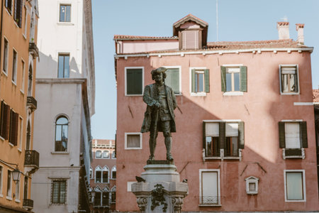 Bronze statue of Daniele Manin on stone pedestal at Campo Manin square in Venice, Italyの写真素材