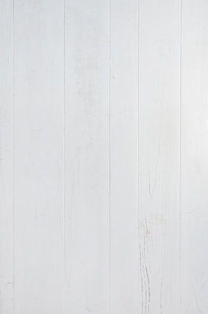 Vertical white wooden planks with visible marks and rustic texture, natural background ideal for design templates and creative decorative useの写真素材