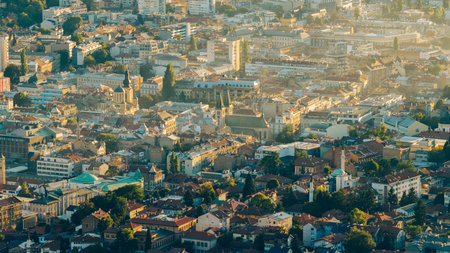 Drone view of Sarajevo old town showing Sacred Heart Cathedral, mosques and traditional rooftops in...